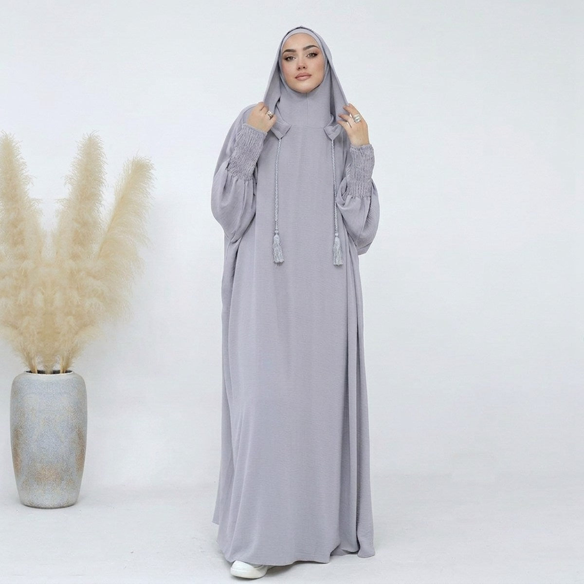 Light gray hooded prayer abaya, full-length front view, cotton-blend with tassel drawstrings